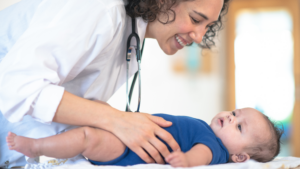doctor caring for infant