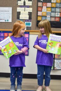 Two Pre Children with workbooks