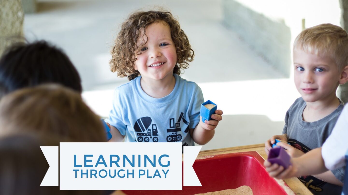 Children enjoying educational play with sand and blocks at a learning center
