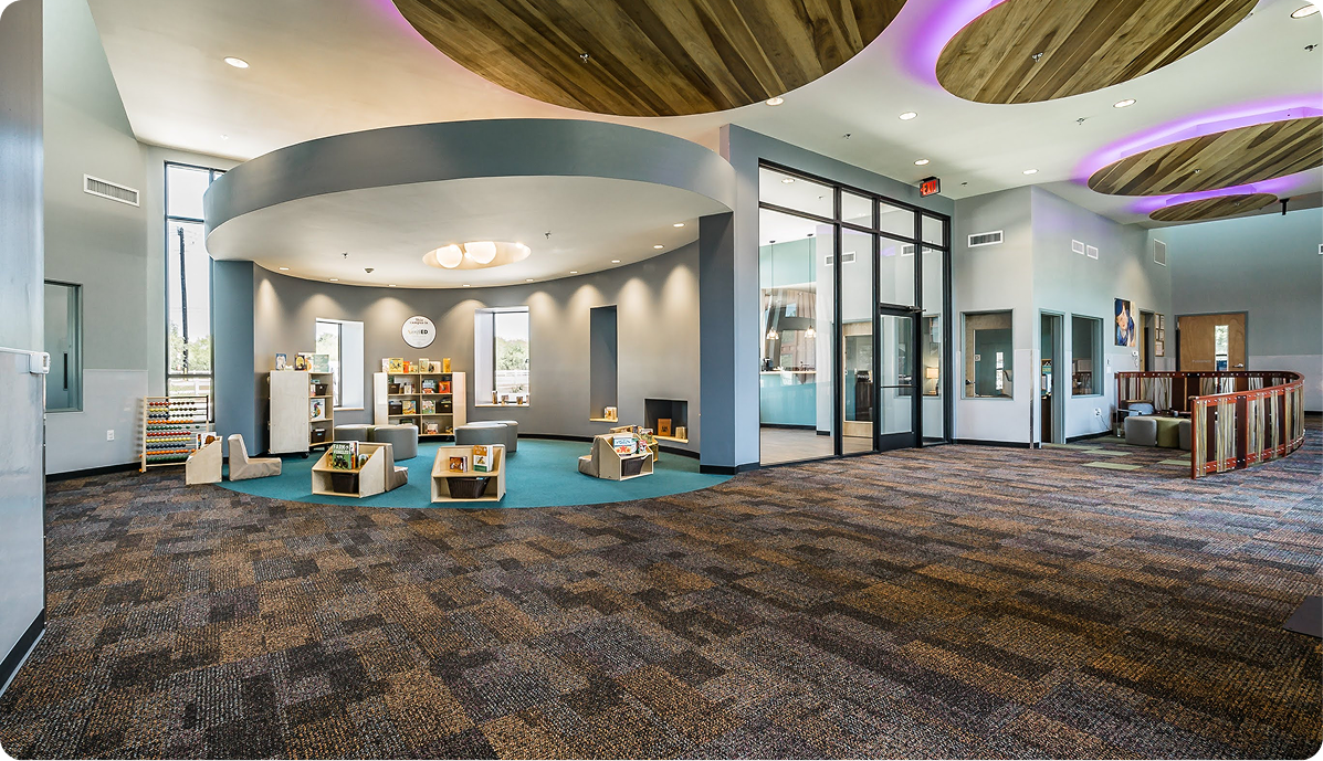 Spacious library reading area with modern design and wooden elements