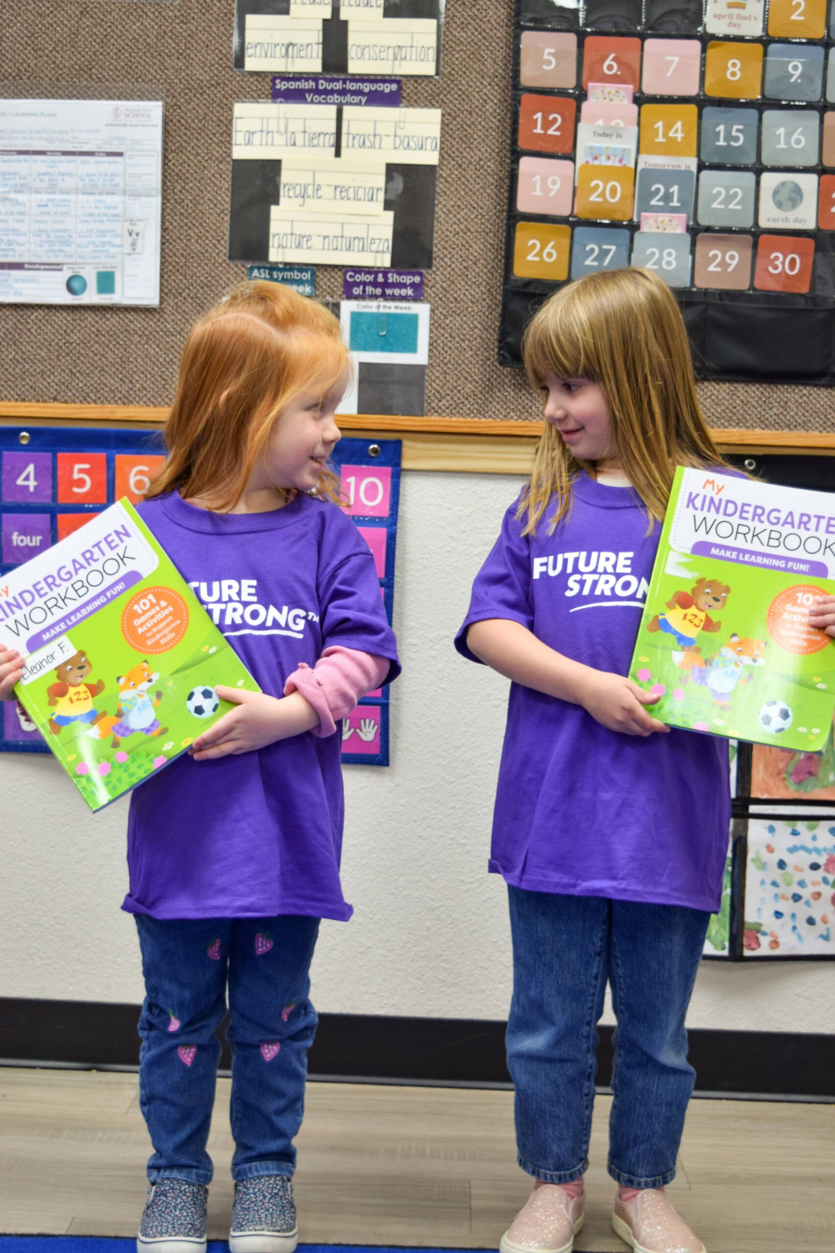 Two Pre Children with workbooks