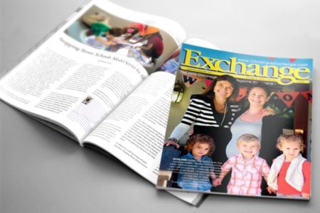 Magazine open to an article with a cover showing three smiling children and two adults indoors.