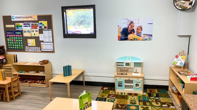 Bright and organized preschool classroom with educational materials and playful decor