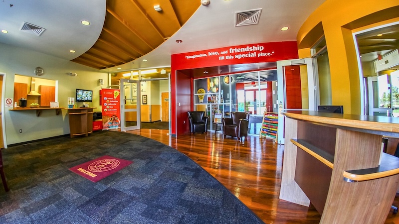 Bright, welcoming interior of a children's center with colorful decor and seating area.